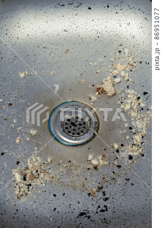 Cleaning service concept. Dirty kitchen sink with food leftovers. Cleaning service concept. Dirty kitchen sink with food leftovers. 86951077