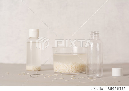 Jar of rice water for skin care face cleansing cosmetic product. Holistic beauty concept, fermented beauty care trend. Copy space 86956535