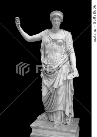 Statue of the Greek goddess Hera or the Roman goddess Juno isolated on black with clipping path. Goddess of women, marriage, family and childbirth. Ancient sculpture 86958606