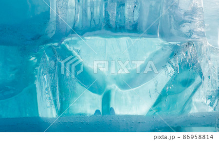 Ice block wall as texture or background. Cold frost transparent bricks pattern 86958814