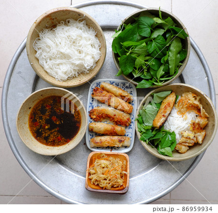 vegan fried spring roll rice noodles with lettuce and basil leaf, soy sauce vegan fried spring roll rice noodles with lettuce and basil leaf, soy sauce 86959934