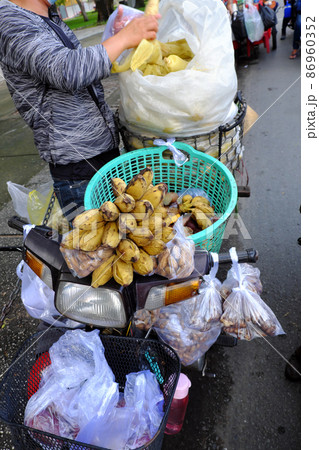 Mobile food store on motorbike to sell cheap breakfast at Ho Chi Minh city, Vietnam 86960352