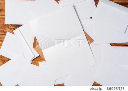 Stack of envelopes on working desk top view. Business mail Stack of envelopes on working desk top view. Business mail 86963523