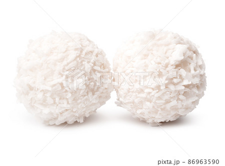 Sweet round coconut candy isolated on white Sweet round coconut candy isolated on white 86963590