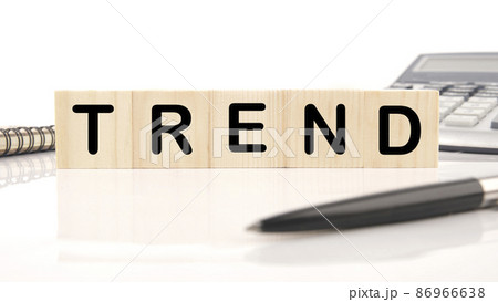 Trend a word written on wooden cubes on a white background. Business, trend or megatrend concept Trend a word written on wooden cubes on a white background. Business, trend or megatrend concept 86966638