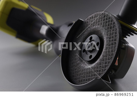 Equipment angle grinder on a gray background 86969251