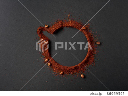 Coffee beans and coffee powder with round copy space. Coffee beans and coffee powder with round copy space. 86969595