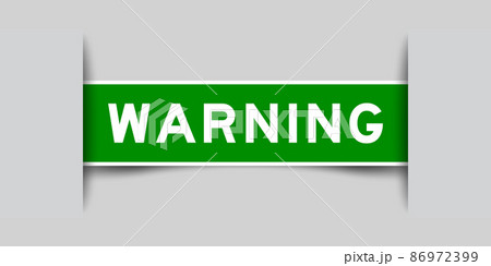 Inserted green color label sticker with word warning on gray background Inserted green color label sticker with word warning on gray background 86972399