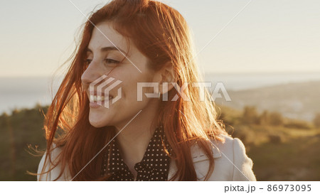 Beautiful girl with white dress explores and smile an ancient Italian castle 86973095