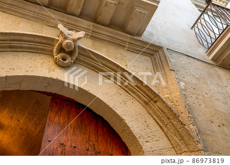 Lecce, Puglia, Italy. August 2021. Detail of a door in the historic center 86973819