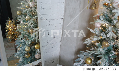 Christmas tree reflected in the mirror. Christmas interior. Christmas tree reflected in the mirror. Christmas interior. 86975333