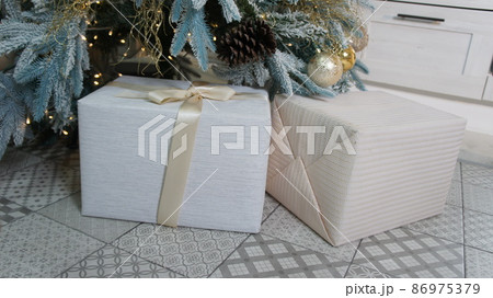 New Year's gifts under the tree. Merry Christmas New Year's gifts under the tree. Merry Christmas 86975379