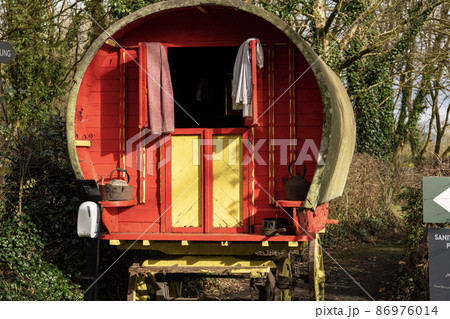 Historical red gypsy caravan, view for tourists Historical red gypsy caravan, view for tourists 86976014