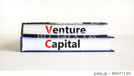 VC venture capital abbraviation symbol. Concept words 'VC venture capital' on books on white table, white background, copy space. Business and VC venture capital concept. VC venture capital abbraviation symbol. Concept words 'VC venture capital' on books on white table, white background, copy space. Business and VC venture capital concept. 86977130