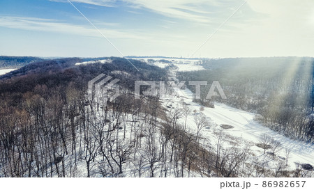 Sun lights up the winter hills 86982657