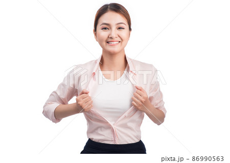 Young pretty asian woman opening her shirt like a superhero isolated on white. 86990563
