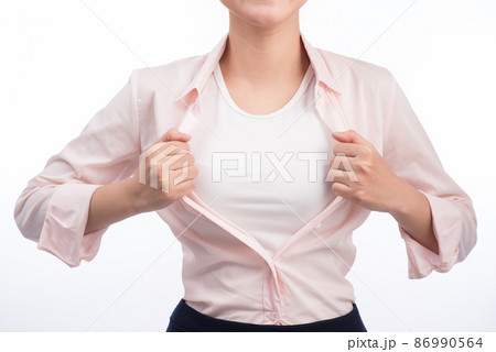 Young pretty asian woman opening her shirt like a superhero isolated on white. 86990564