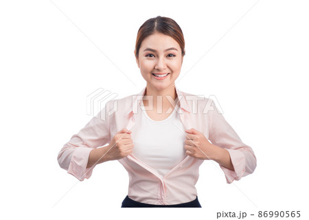 Young pretty asian woman opening her shirt like a superhero isolated on white. 86990565
