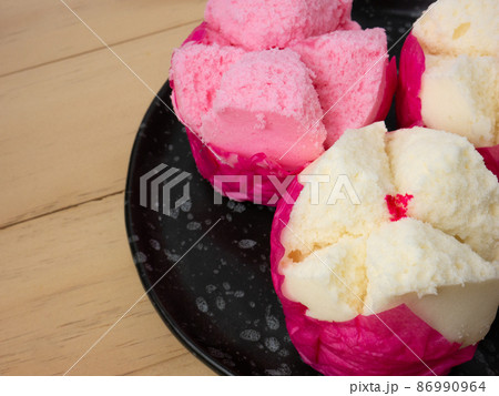 The Chinese fluffy rice flour cake on wood table for celebration day The Chinese fluffy rice flour cake on wood table for celebration day 86990964