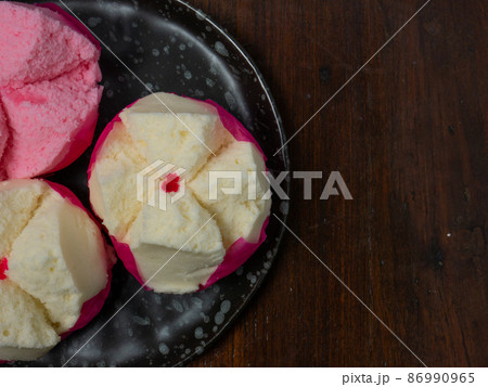 The Chinese fluffy rice flour cake on wood table for celebration day The Chinese fluffy rice flour cake on wood table for celebration day 86990965