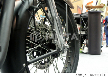 SELANGOR, MALAYSIA - MARCH 4, 2021: Motorcycle tires made from quality rubber. The tires selected must be in accordance with the specifications recommended by the manufacturer. SELANGOR, MALAYSIA - MARCH 4, 2021: Motorcycle tires made from quality rubber. The tires selected must be in accordance with the specifications recommended by the manufacturer. 86998121
