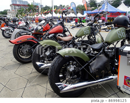 SELANGOR, MALAYSIA - MARCH 4, 2021: Motorcycle tires made from quality rubber. The tires selected must be in accordance with the specifications recommended by the manufacturer. SELANGOR, MALAYSIA - MARCH 4, 2021: Motorcycle tires made from quality rubber. The tires selected must be in accordance with the specifications recommended by the manufacturer. 86998125