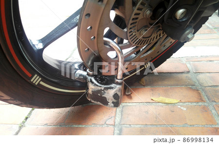 SELANGOR, MALAYSIA - MARCH 4, 2021: Motorcycle tires made from quality rubber. The tires selected must be in accordance with the specifications recommended by the manufacturer. 86998134