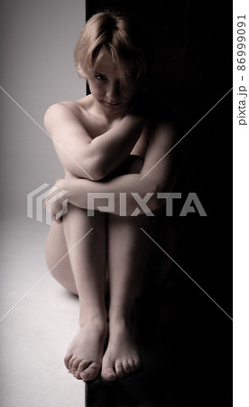ladies without dress pictures The girl sits clothes, naked on a black... - Stock Photo [86999091] Cowl Neck Midi Dress