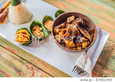 Lifestyle food. A dish consisting of rice, fried fish with wood mushrooms and different kinds of sauces Lifestyle food. A dish consisting of rice, fried fish with wood mushrooms and different kinds of sauces 87001493