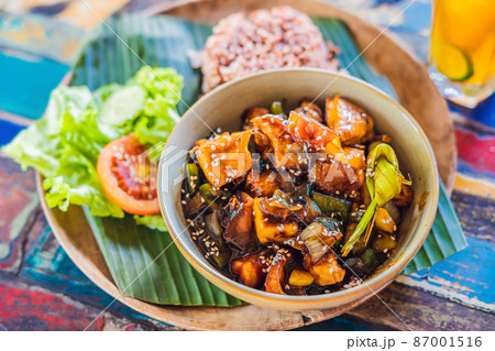 Popular Balinese meal of rice with variety of side dishes which are served together with the rice and more as optional extras 87001516