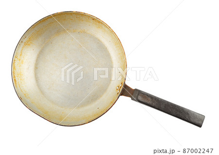 old stained aluminium pan with burnt fat isolated in white background old stained aluminium pan with burnt fat isolated in white background 87002247