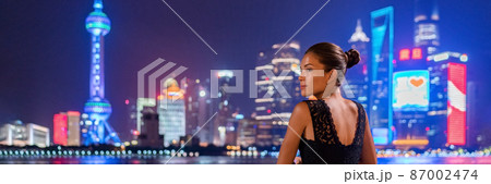 Shanghai woman travel China Luxury lifestyle of the rich chinese millionaires. Asian elegant lady going out in city nightlife looking at skyline vew panoramic landscape Shanghai woman travel China Luxury lifestyle of the rich chinese millionaires. Asian elegant lady going out in city nightlife looking at skyline vew panoramic landscape 87002474