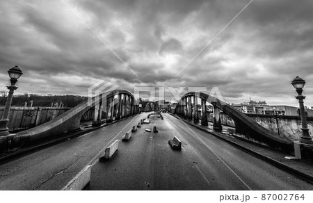 Schaerbeek, Brussels / Belgium -  The dilapidated Albert Bridge with dark rainy sky in black and white 87002764