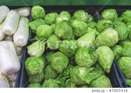 Pile of cabbage in boxes. cabbage in supermarket. Pile of cabbage in boxes. cabbage in supermarket. 87003416