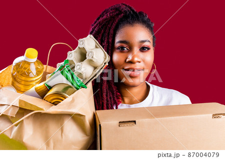 hispanic american volunteer supporting food donation concept 87004079