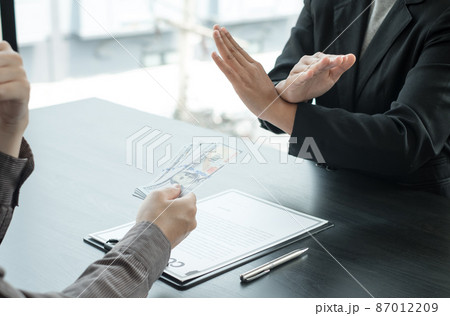 Corruption. The businessman denies the money proposed by his partner to bribe the concept of bribery and corruption Corruption. The businessman denies the money proposed by his partner to bribe the concept of bribery and corruption 87012209