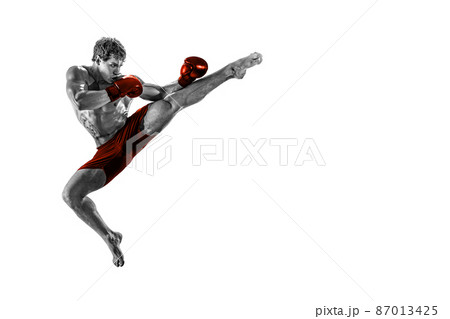 Black and white athlete boxer in jump in red gloves isolated on white background. Sport concept Black and white athlete boxer in jump in red gloves isolated on white background. Sport concept 87013425