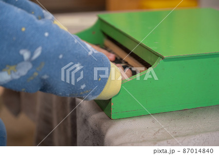 A boy playing a toy piano. A boy playing a toy piano. 87014840