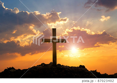 Cross on mountain sunset background. Easter concept. Cross on mountain sunset background. Easter concept. 87023402
