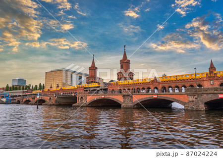 Berlin Germany, sunset city skyline at Oberbaum Bridge and Berlin Metro Berlin Germany, sunset city skyline at Oberbaum Bridge and Berlin Metro 87024224