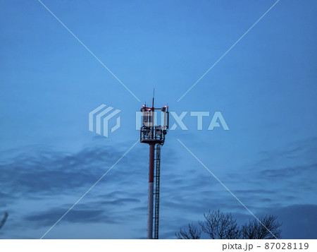 Mobile communications tower on the background of the night sky. Mobile communications tower on the background of the night sky. 87028119