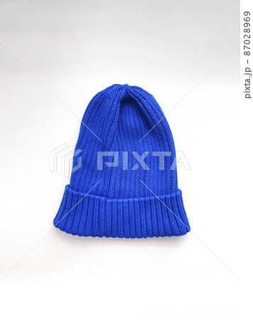 Blue knitted wool cap isolated on white background 87028969