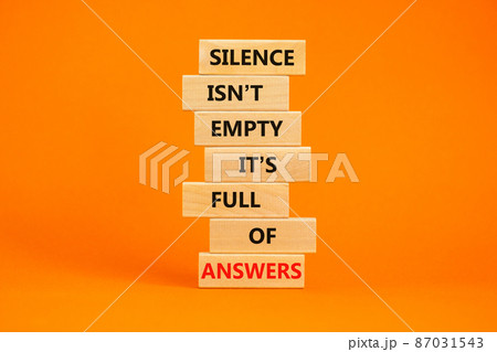 Answers in silence symbol. Wooden blocks with words Silence is not empty it is full of answers. Beautiful orange table, orange background, copy space. Business, answers in silence concept. 87031543