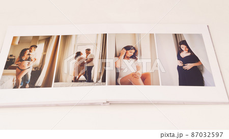 the pages of a photobook with a lovely couple pregnancy photo shoot. the pages of a photobook with a lovely couple pregnancy photo shoot. 87032597