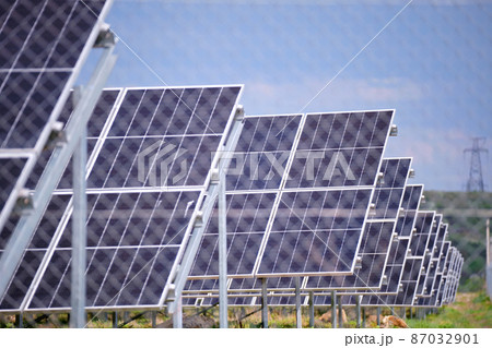 Ground based frame of large sustainable electrical power plant with rows of solar photovoltaic panels for producing clean ecological electric energy. Renewable electricity with zero emission concept Ground based frame of large sustainable electrical power plant with rows of solar photovoltaic panels for producing clean ecological electric energy. Renewable electricity with zero emission concept 87032901
