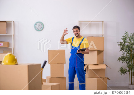 Young male contractor doing home relocation Young male contractor doing home relocation 87036584