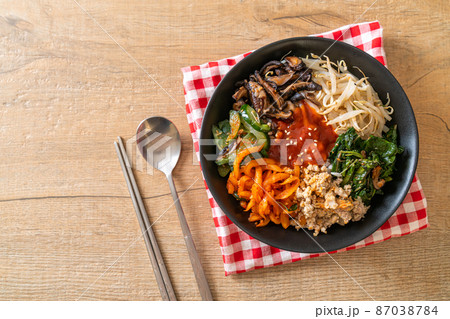 Korean spicy salad with rice - traditionally Korean food, Bibimbap Korean spicy salad with rice - traditionally Korean food, Bibimbap 87038784