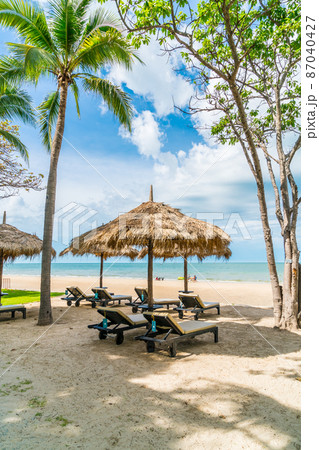 beach chair and umbrella with sea beach background beach chair and umbrella with sea beach background 87040427