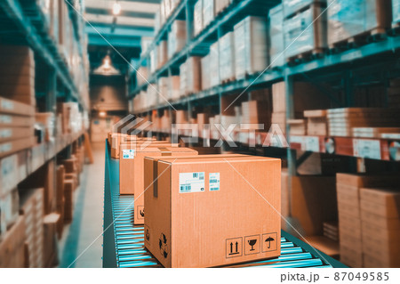 parcels on conveyor belt in a warehouse. parcels on conveyor belt in a warehouse. 87049585