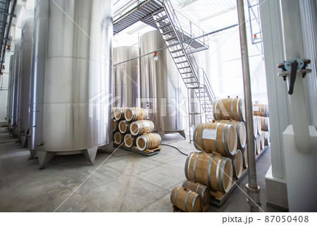 Rows of wine barrels in vaults at the winery. 87050408